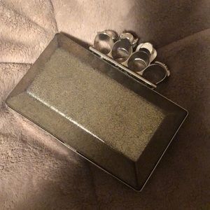 Brass knuckle ring clutch purse